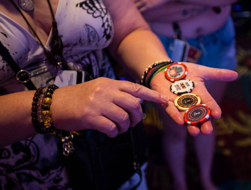 Juli Mangun, of Calif., shows off her YouTuber Brian Christopher chips while attending the unve ...