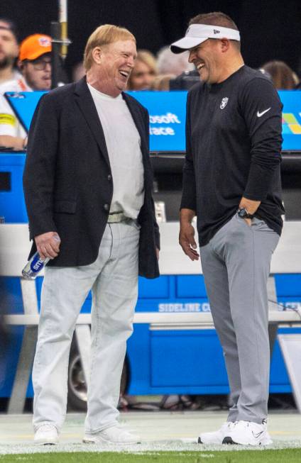 Raiders owner Mark Davis, left, and head coach Josh McDaniels share moment before an NFL game a ...