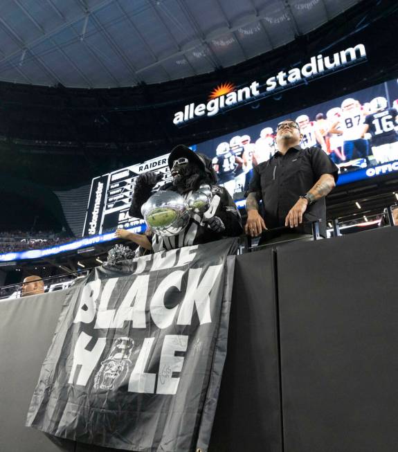 Raiders’ fan Mark Acasio, known as Gorilla Rilla, cheers during the second half of an NF ...