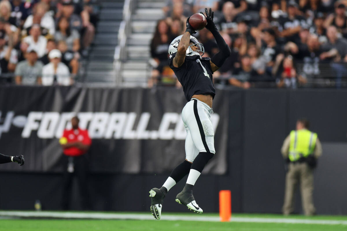 Raiders wide receiver Tyron Johnson (1) makes a catch during the first half of their NFL presea ...