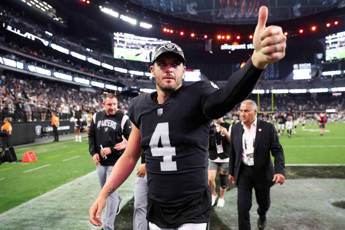 Raiders quarterback Derek Carr (4) leads the field at the end of a NFL preseason football game ...