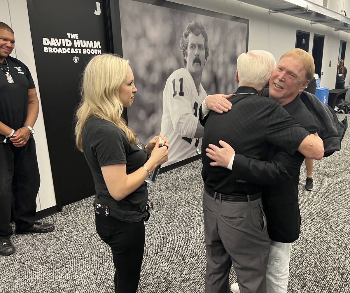 Las Vegas Raiders owners Mark Davis hugs Tom Humm, brother of ex-UNLV and Oakland Raiders great ...