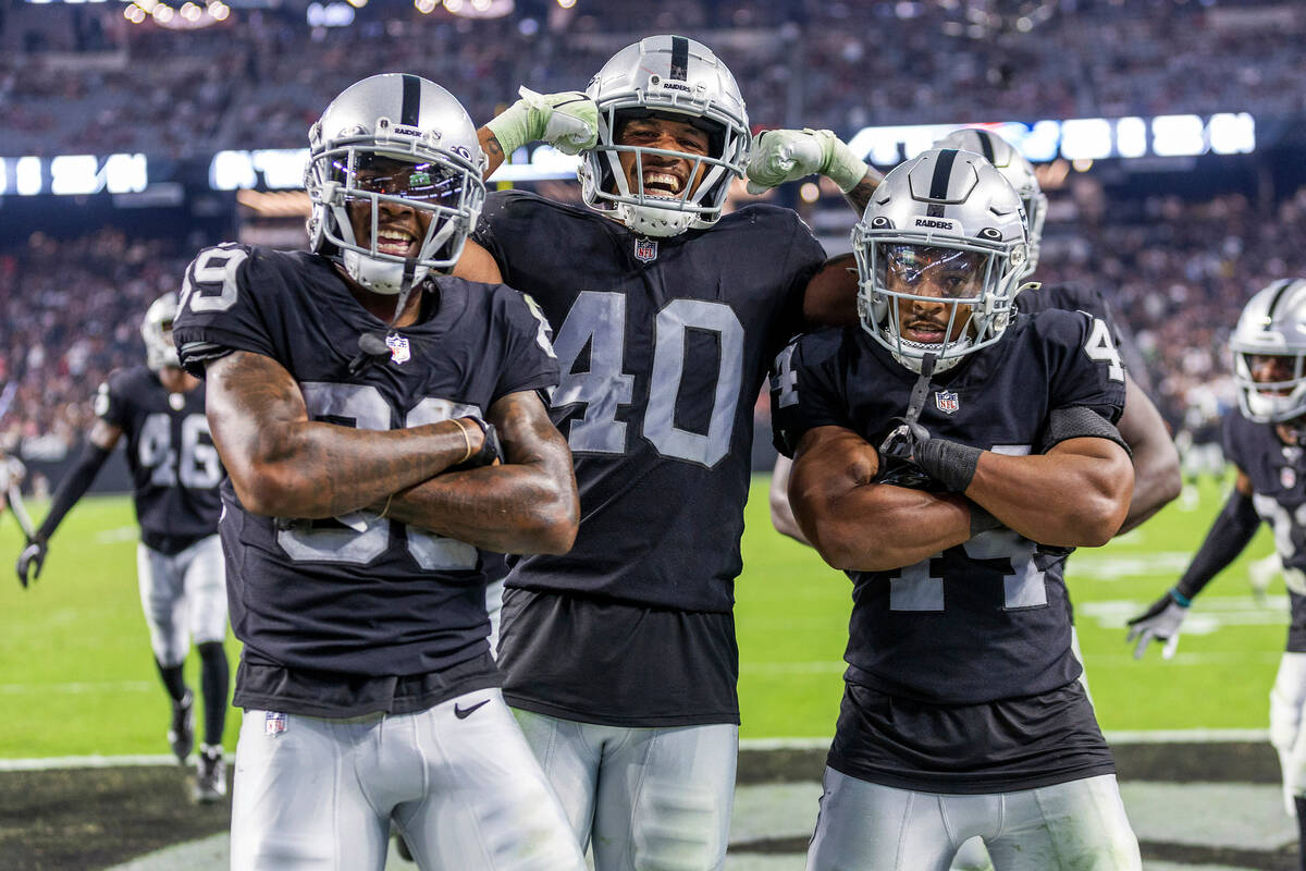 Raiders wide receiver Isaiah Zuber (89), safety Isaiah Pola-Mao (40) and cornerback Bryce Cosby ...