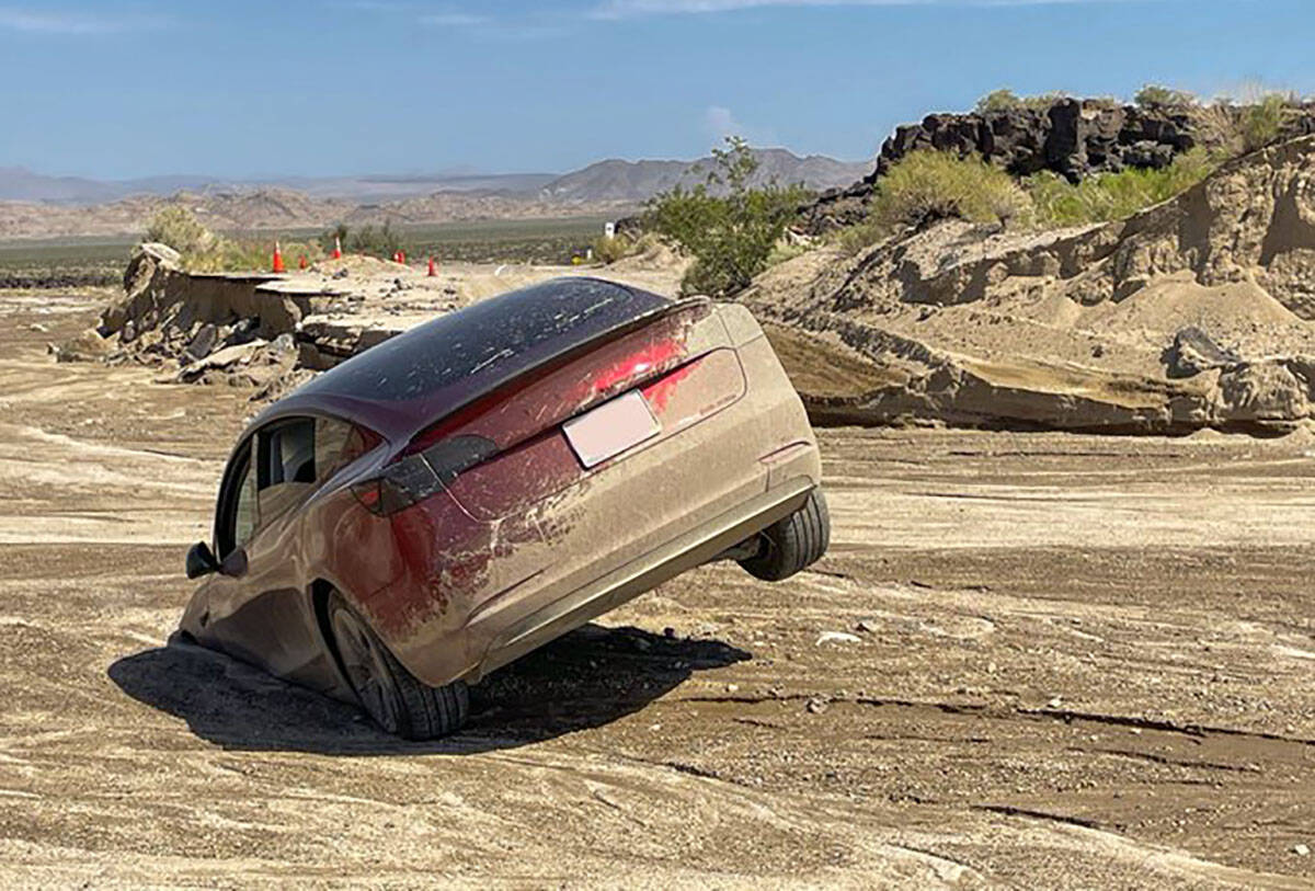 A car mired in the mud at Mojave National Preserve in California on Friday, Aug. 26, 2022. The ...