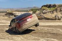 A car mired in the mud at Mojave National Preserve in California on Friday, Aug. 26, 2022. The ...