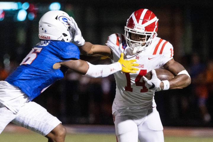 Mater Dei's wide receiver Jordan Onovughe (14) runs past Bishop Gorman's defensive back Jeremia ...