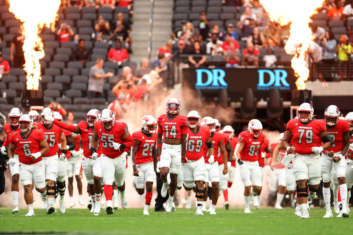 UNLV Rebels take the field before the start of a NCAA football game against Idaho State Bengals ...