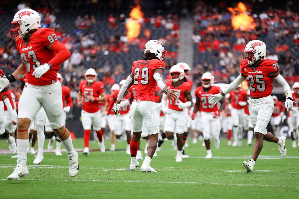 UNLV Rebels take the field before the start of a NCAA football game against Idaho State Bengals ...