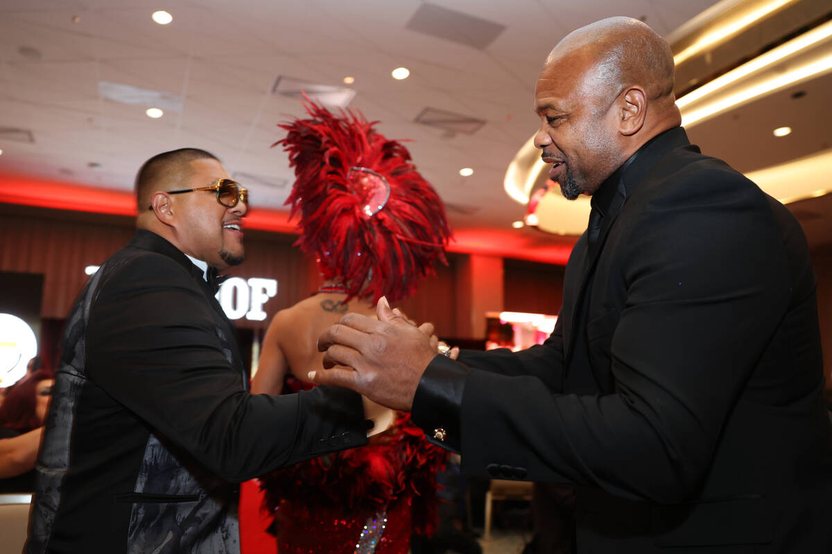Retired boxers Fernando Vargas, left, and Roy Jones Jr., embrace each other during the Nevada B ...