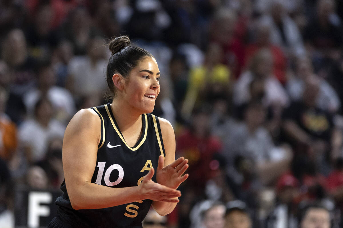 Las Vegas Aces guard Kelsey Plum (10) claps after scoring during the first half in Game 1 of a ...