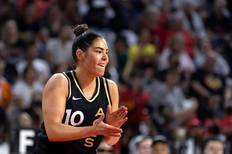 Las Vegas Aces guard Kelsey Plum (10) claps after scoring during the first half in Game 1 of a ...