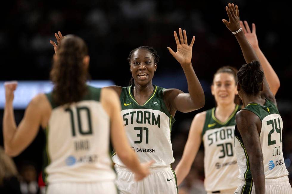 Seattle Storm guard Sue Bird (10), center Tina Charles (31), forward Breanna Stewart (30) and g ...