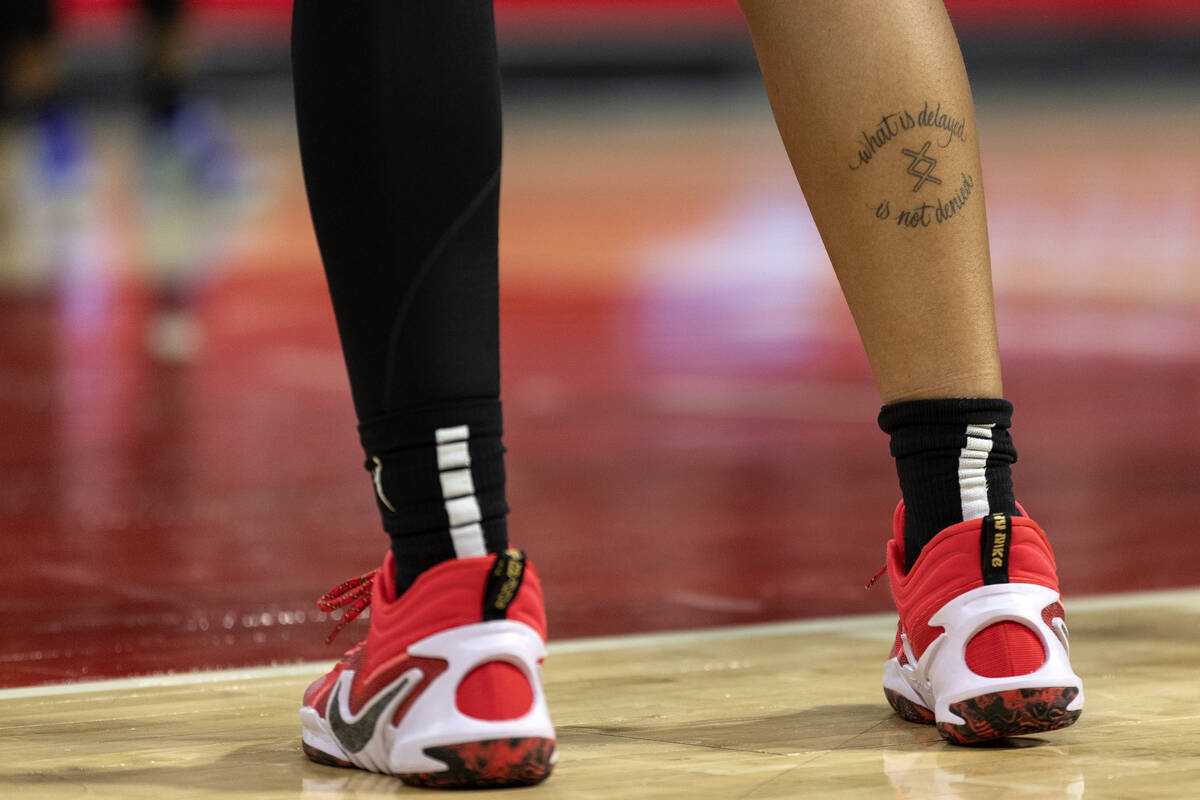 Las Vegas Aces forward A'ja Wilson’s calf tattoo reads “what is delayed is not de ...