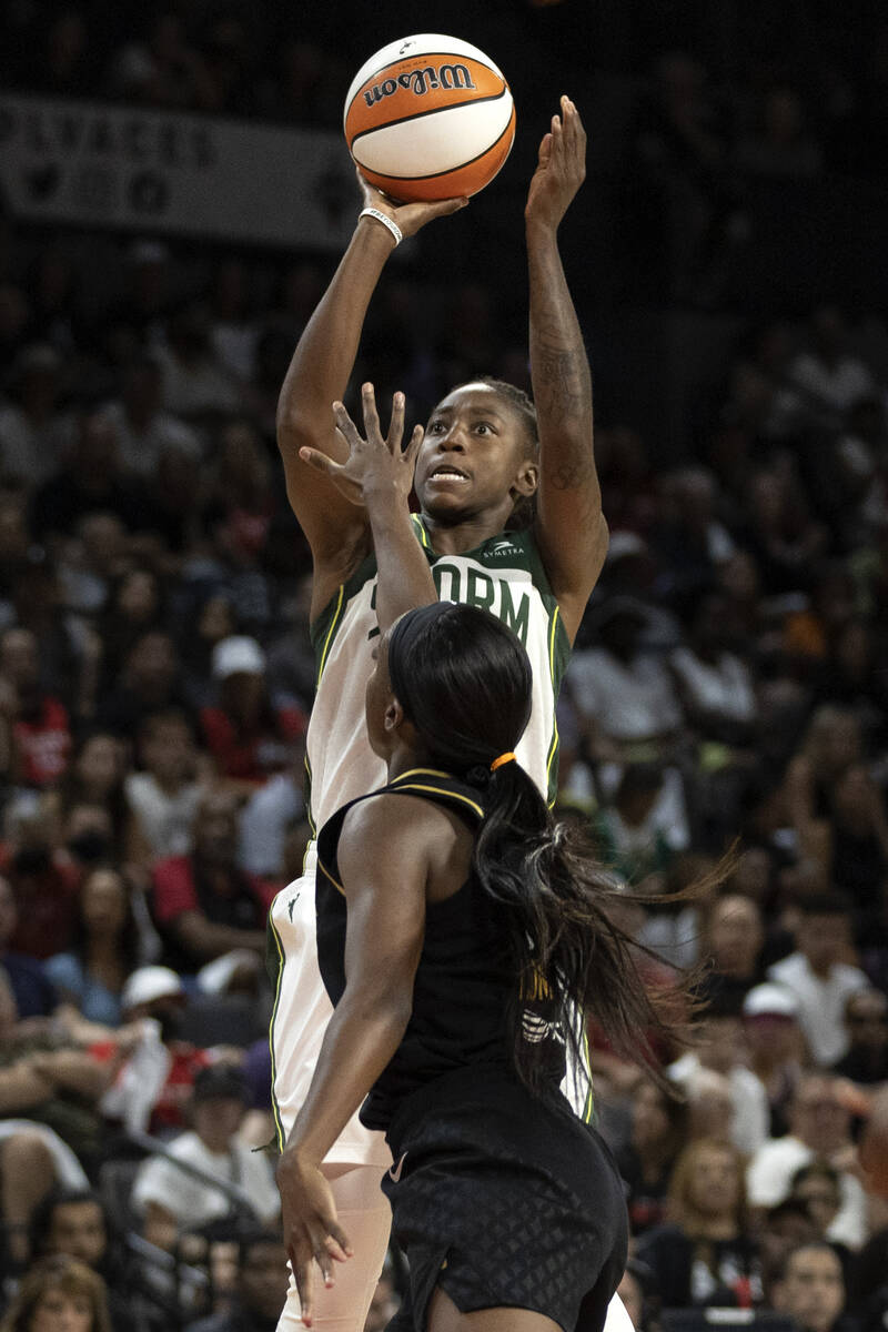 Seattle Storm guard Jewell Loyd (24) shoots against Las Vegas Aces guard Jackie Young (0) durin ...