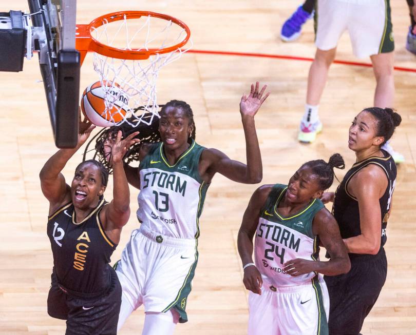 Las Vegas Aces guard Chelsea Gray (12) is fouled from behind on the drive to the basket by Seat ...