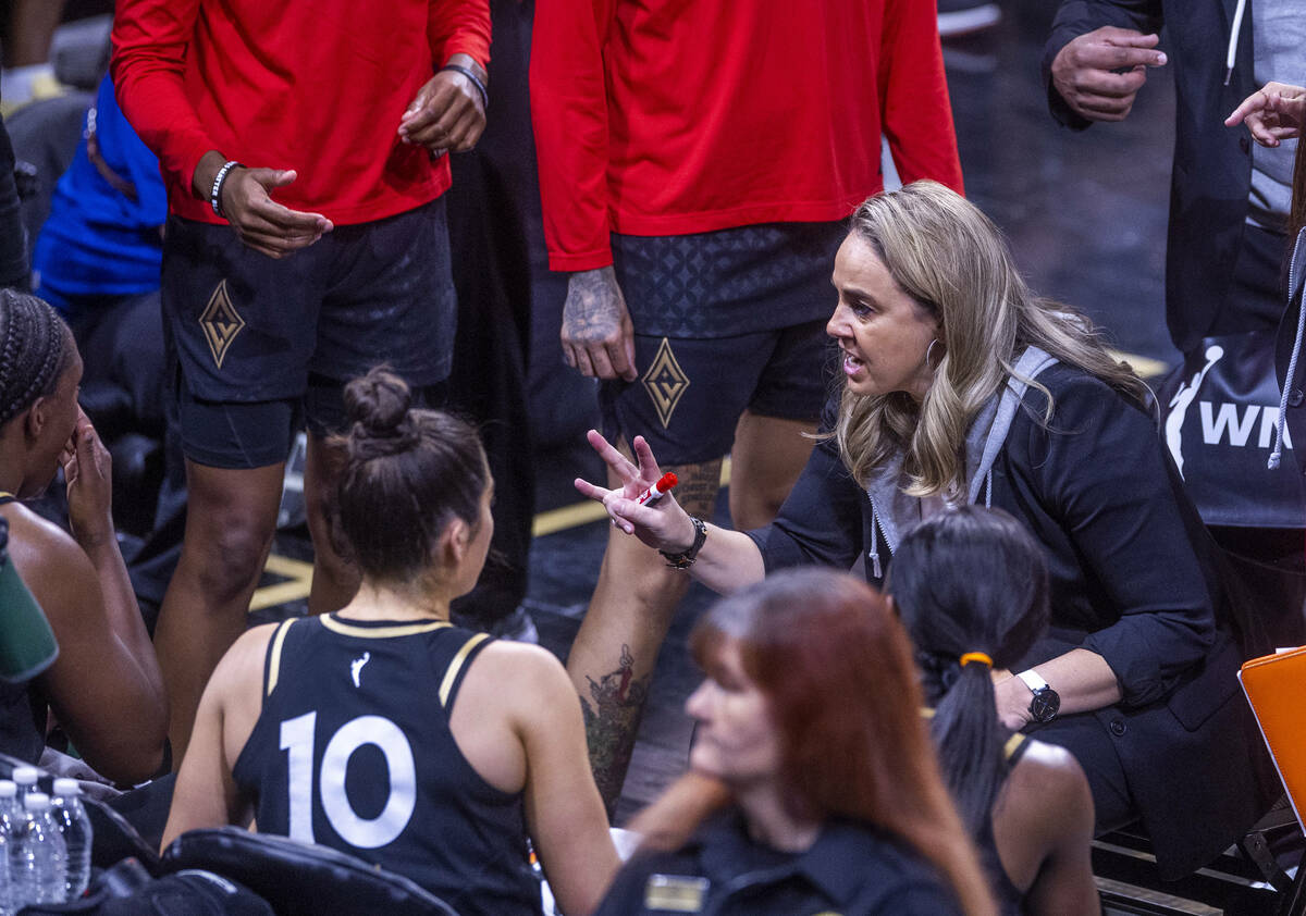 Aces head coach Becky Hammon counsels her players on a timeout during the first half versus Sea ...