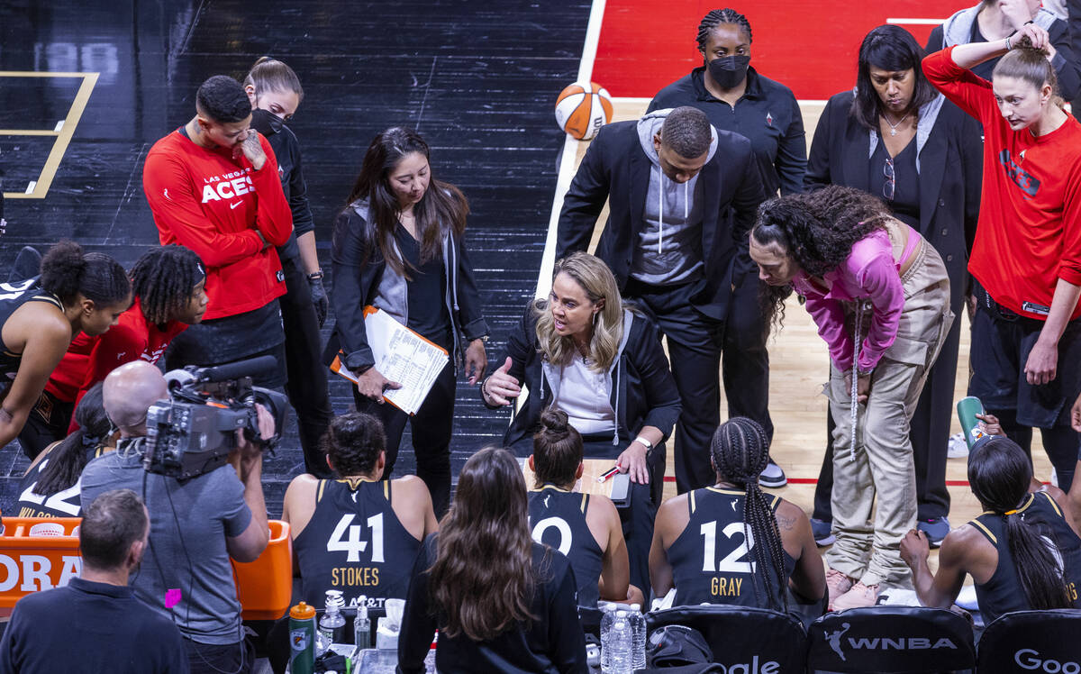 Las Vegas Aces head coach Becky Hammon counsels her players on a timeout during the first half ...