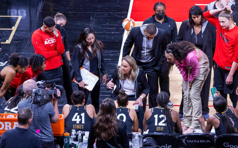 Las Vegas Aces head coach Becky Hammon counsels her players on a timeout during the first half ...