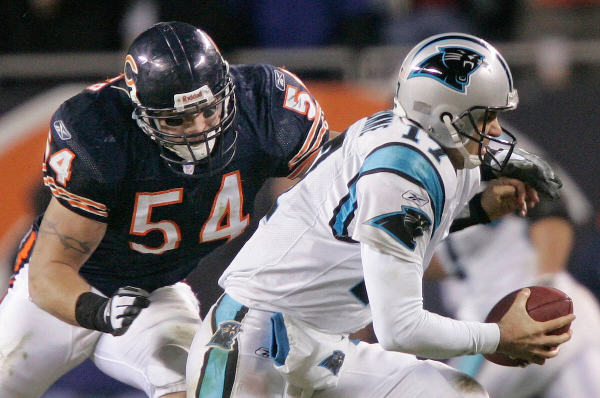 In this Jan. 15, 2006, file photo, Chicago Bears' linebacker Brian Urlacher (54) attempts to sa ...