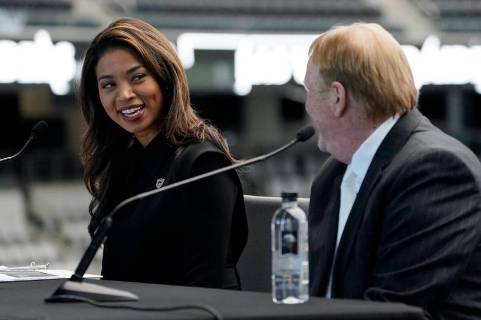 Sandra Douglass Morgan, left, speaks beside Las Vegas Raiders owner Mark Davis during a news co ...