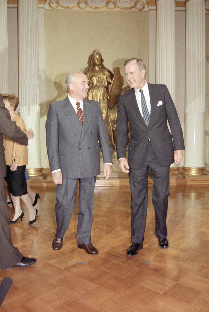 Soviet Presidential Mikhail Gorbachev and U.S. President George Bush are shown where to stand t ...