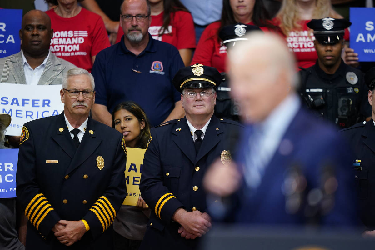 Wilkes-Barre Fire Department Chief Jay Delaney and Police Chief Joseph Coffay listen, as Presid ...