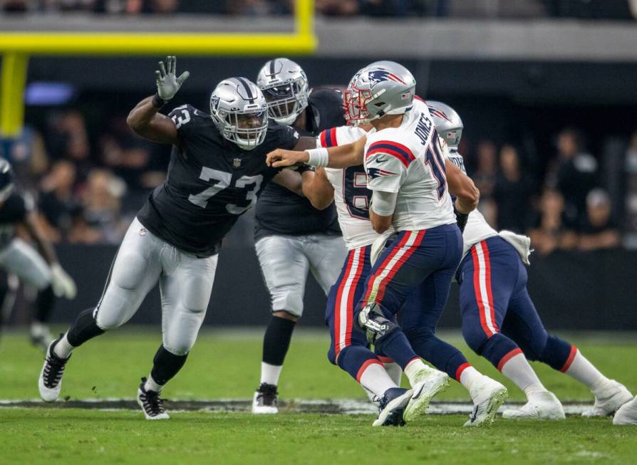 Raiders defensive tackle Matthew Butler (73) pressures New England Patriots quarterback Mac Jo ...