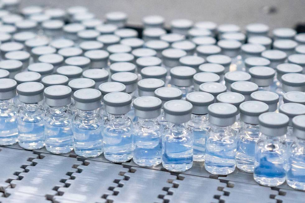 This August 2022 photo provided by Pfizer shows vials of the company's updated COVID-19 vaccine ...