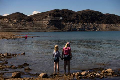 A pair of girls look out at Swim Beach at Lake Mead National Recreation Area on Sunday, Aug. 7, ...