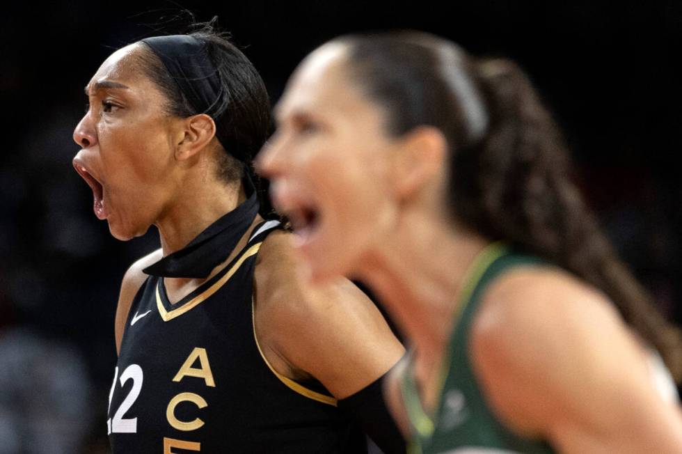 Las Vegas Aces forward A'ja Wilson (22) and Seattle Storm guard Sue Bird (10) react after Wilso ...