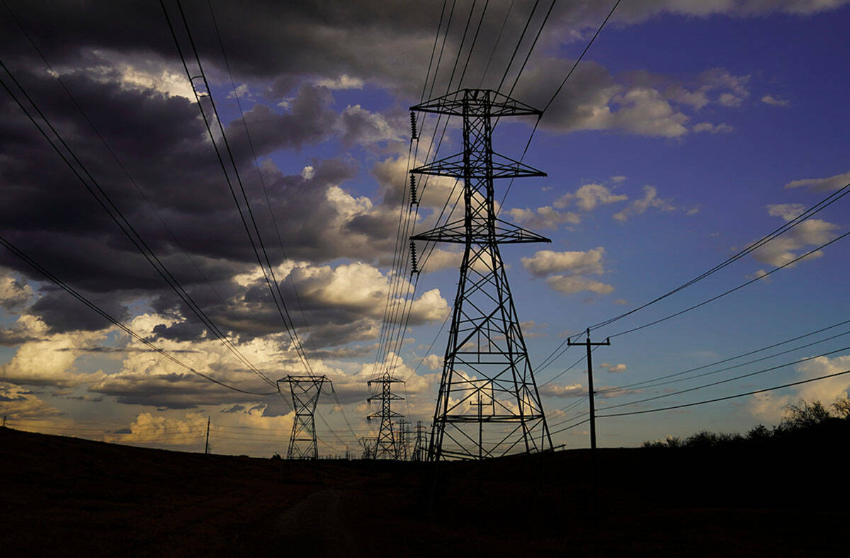 Power lines are seen under a cloudy sky, Wednesday, Aug. 10, 2022, in San Antonio. (AP Photo/Er ...