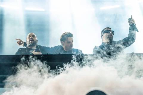 Steve Angello, left, Axwell, and Sebastian Ingrosso of Swedish House Mafia perform at the Coach ...