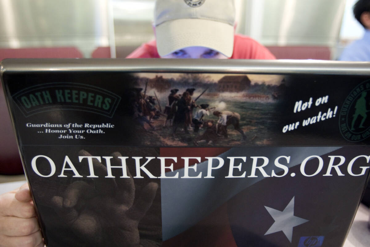 A Southern Nevada Oath Keepers member who declined to be identified works on the group's Websit ...