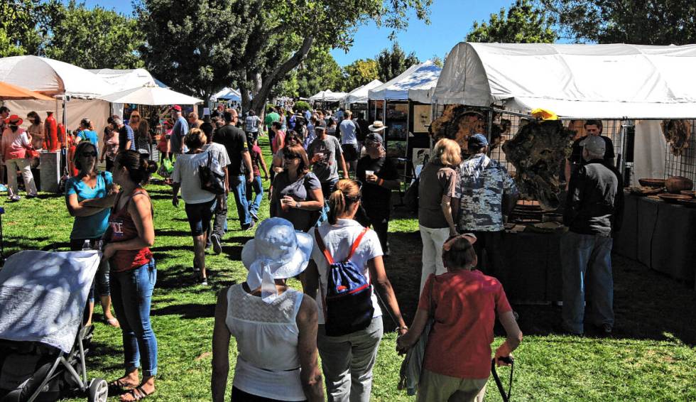 Guests at the Art in the Park festival in Boulder City, Saturday, Oct. 7, 2017. Gabriella Benav ...