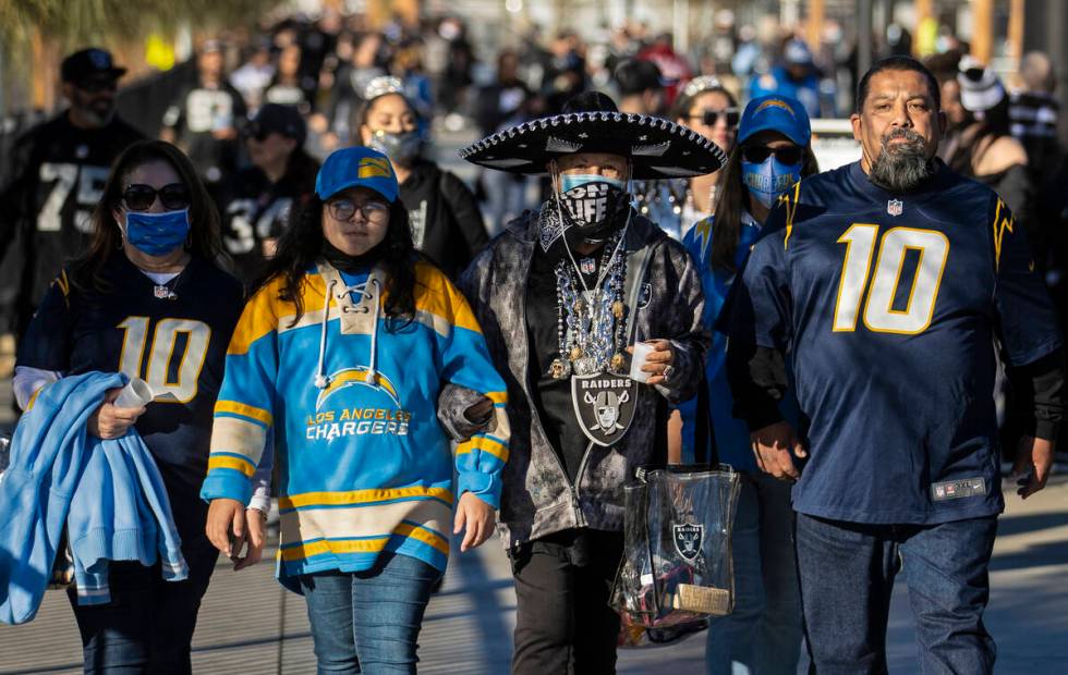 Raiders and Los Angeles Chargers fans before the start of an NFL football game on Sunday, Jan. ...