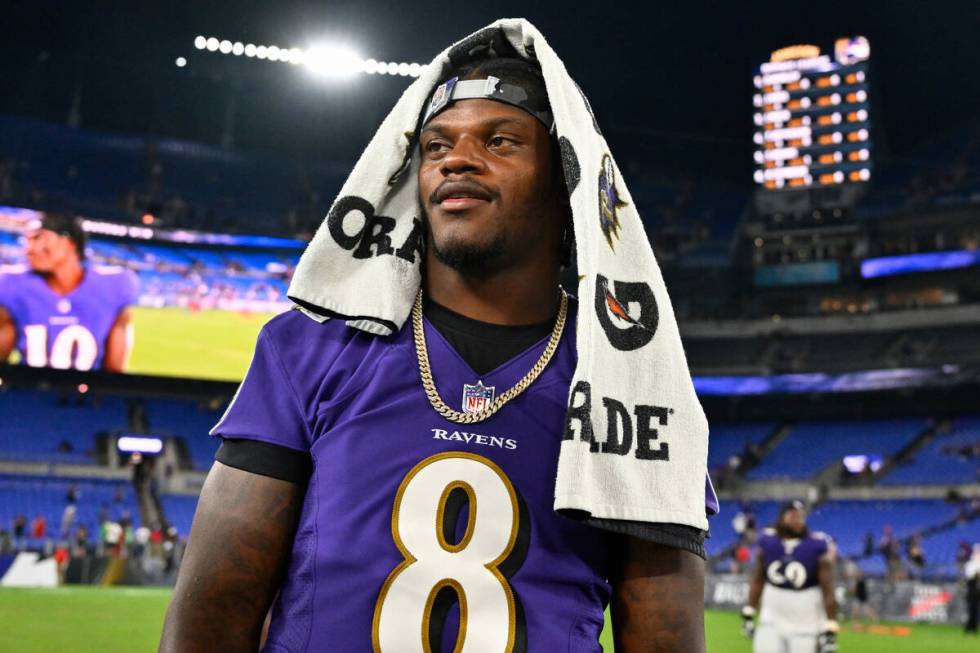 Baltimore Ravens quarterback Lamar Jackson (8) looks on after a NFL preseason football game aga ...