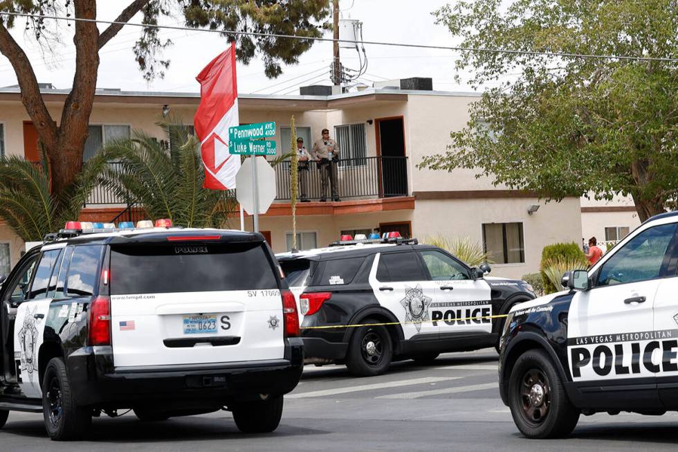 Las Vegas police investigate around the 4100 block of Pennwood Avenue, Tuesday, Aug. 9, 2022, i ...