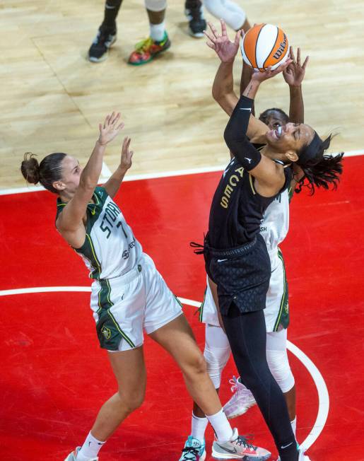 Las Vegas Aces forward A'ja Wilson (22) powers up for a basket over Seattle Storm center Tina C ...