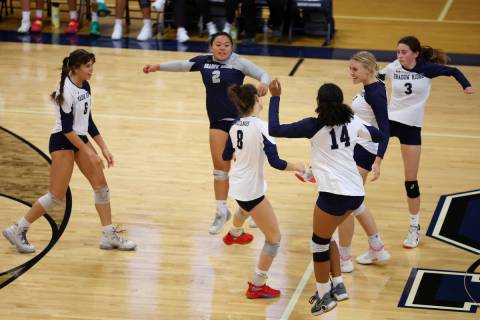 Shadow Ridge players react after scoring a point against Palo Verde during a girl's volleyball ...