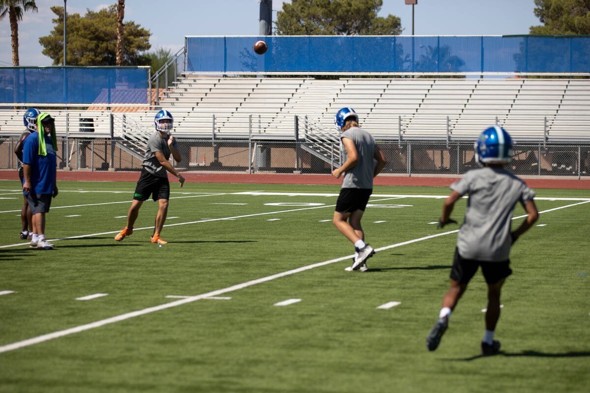 Quarterback Jack Thow throws the ball during a football practice at Green Valley High School in ...