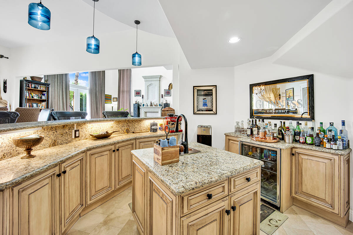 The kitchen features custom cabinetry and shelving. (Great Bridge Properties)