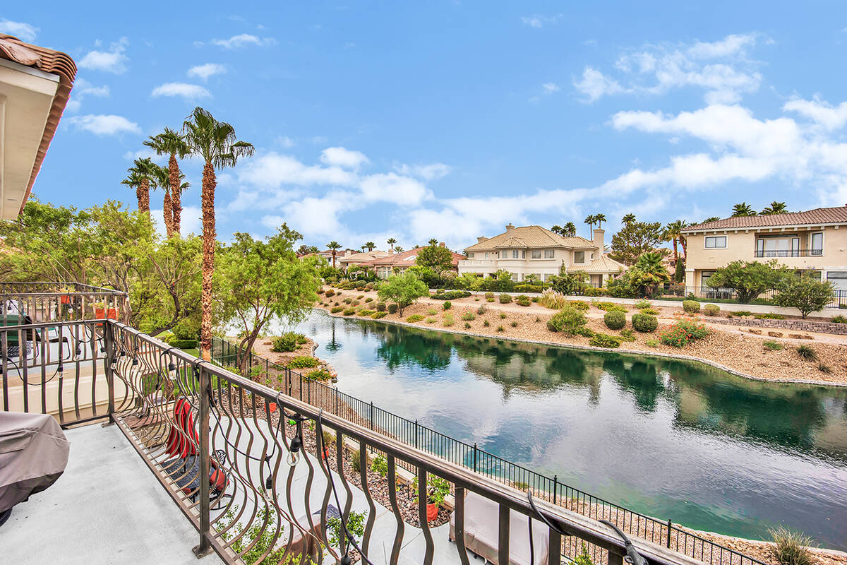 The residence is located on the lagoon in Canyon Gate Country Club in close proximity to the te ...