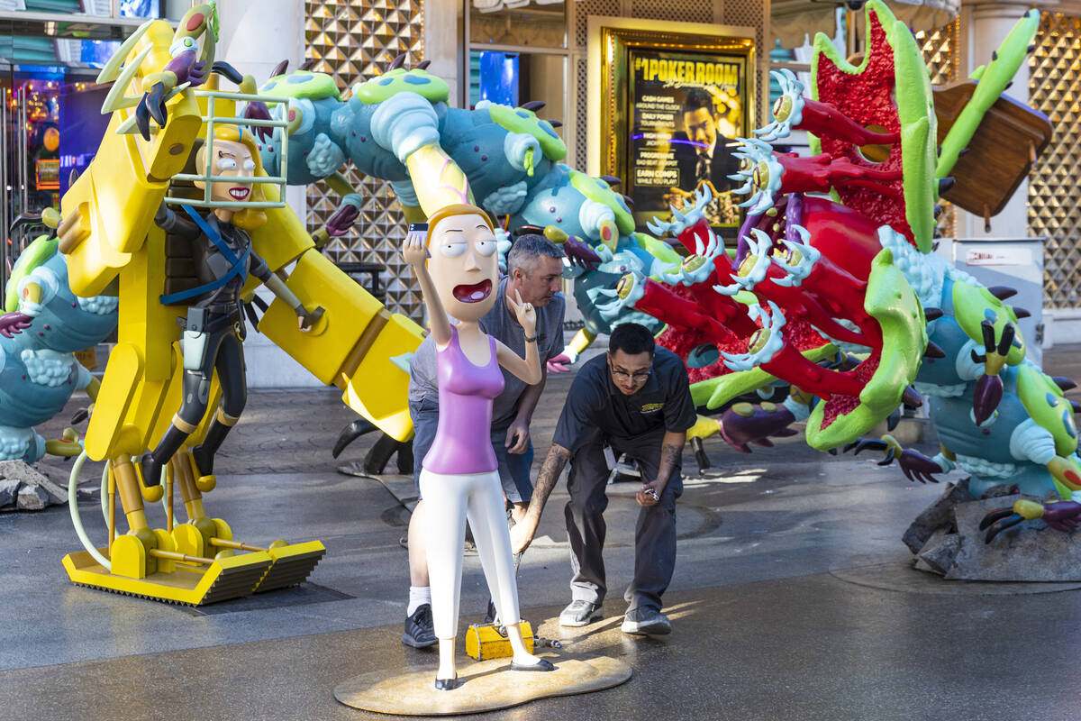 Workers display figures of characters from the Adult Swim TV show "Rick and Morty," S ...