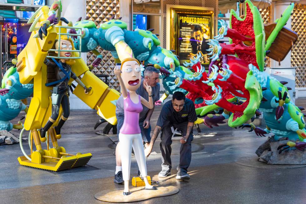 Workers display figures of characters from the Adult Swim TV show "Rick and Morty," S ...