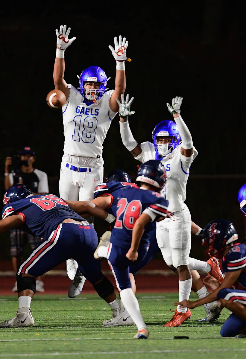 Bishop Gorman linebacker Jonah Leaea (18) attempted a block during a game between the Bishop G ...