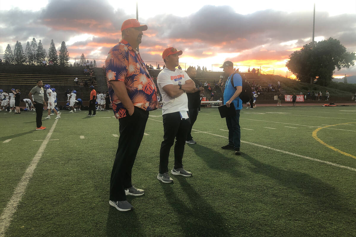 Bishop Gorman coach Brent Browner, right, watches the Gaels warm up before the game Friday, Sep ...