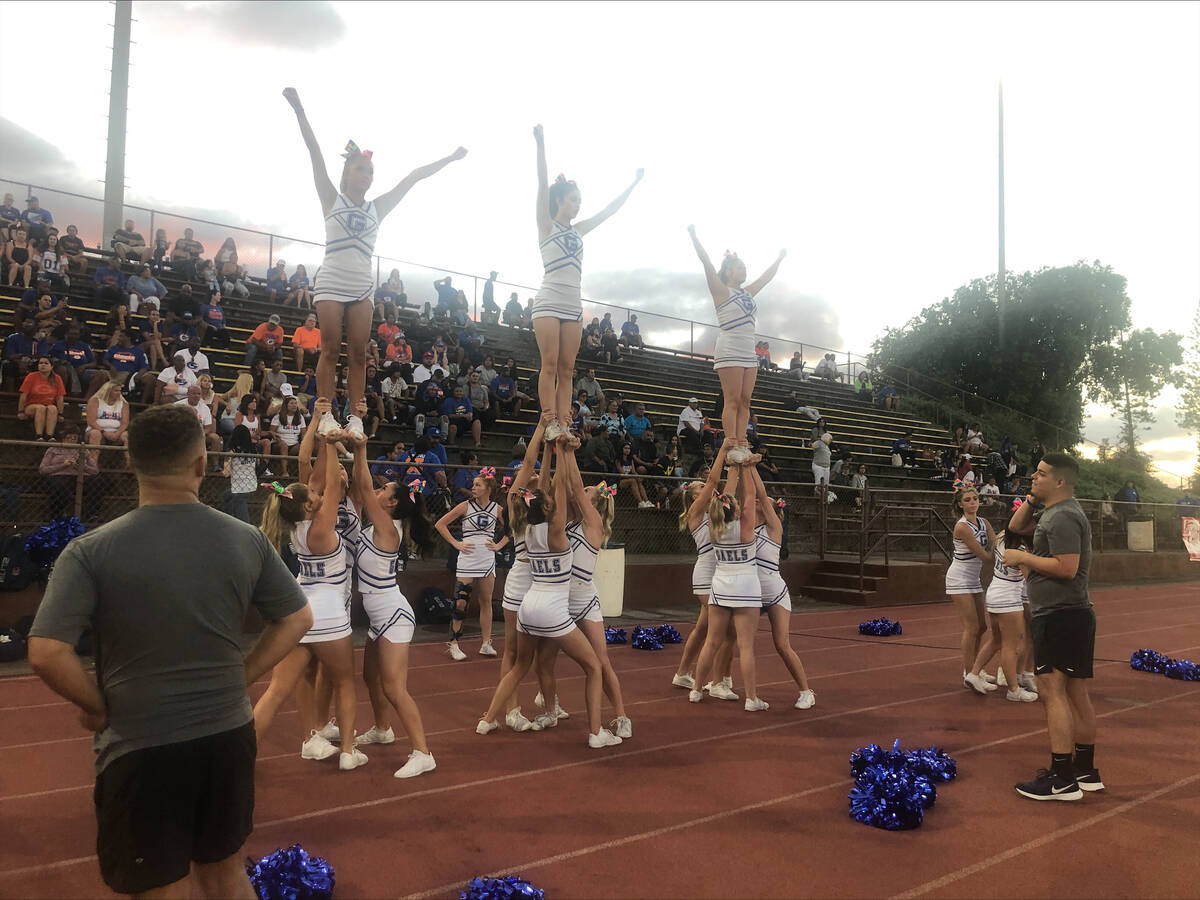 Bishop Gorman's cheerleaders get ready for the game Friday, Sept. 2, 2022, against St. Louis in ...