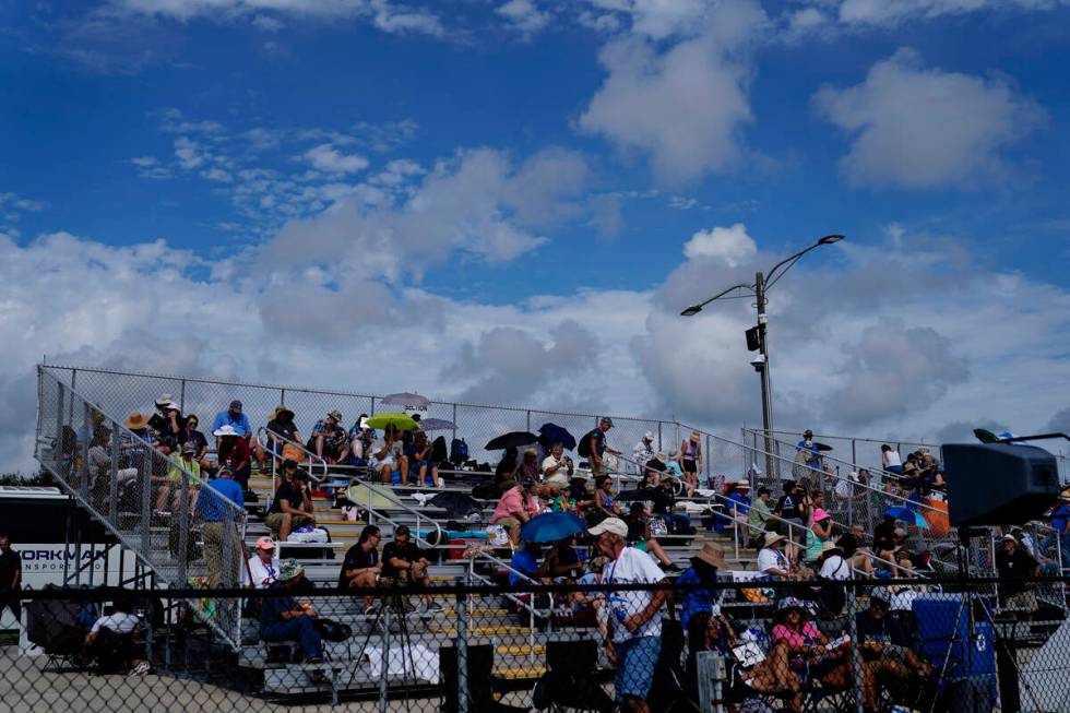 People wait for the NASA moon rocket to launch on Pad 39B before the Artemis 1 mission to orbit ...