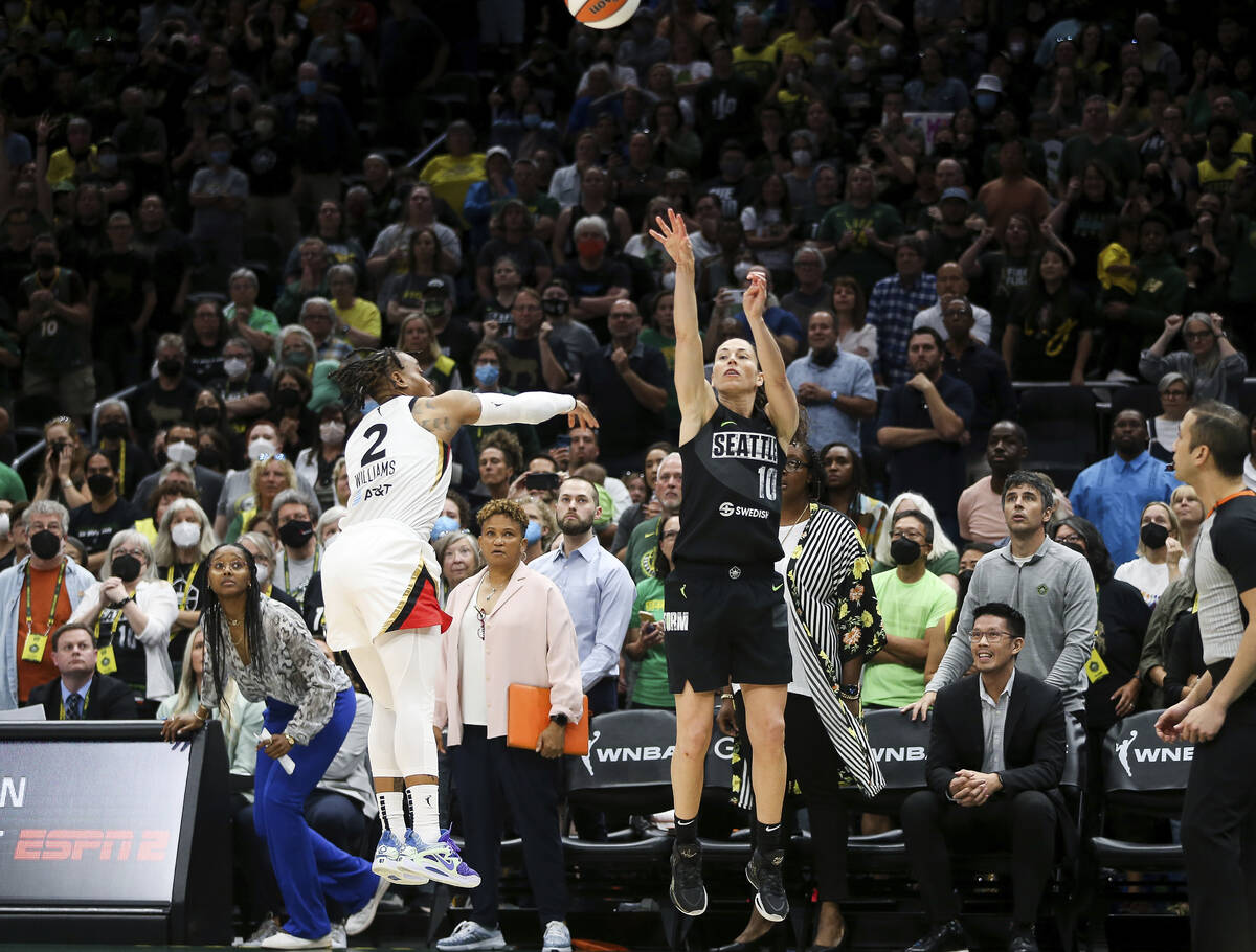 Seattle Storm guard Sue Bird (10) makes a 3-point basket over the defense of Las Vegas Aces gua ...