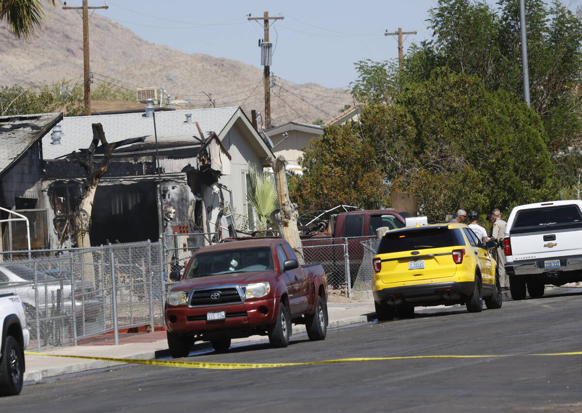 Officials investigate a fatal fire on Yellowstone Avenue, Monday, Sept. 5, 2022, in northeast L ...